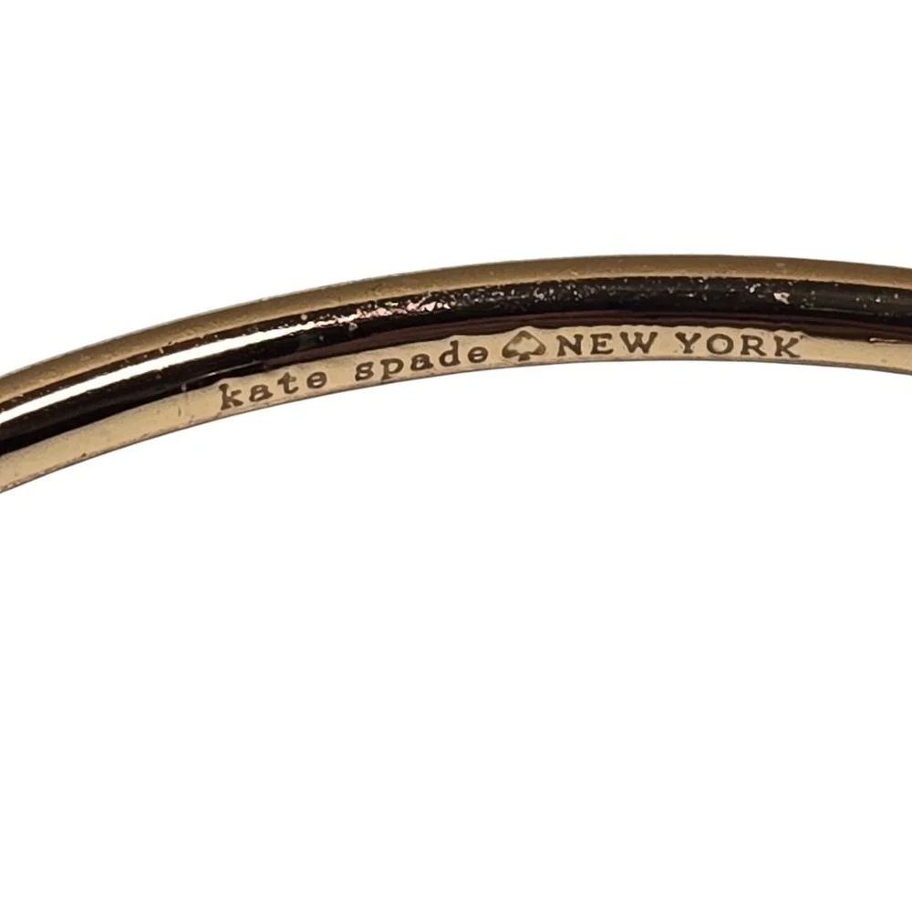 Kate Spade Goldtone NY Ribbon Bow Bangle Bracelet Size 7 Foldover Clasp Dustbag
